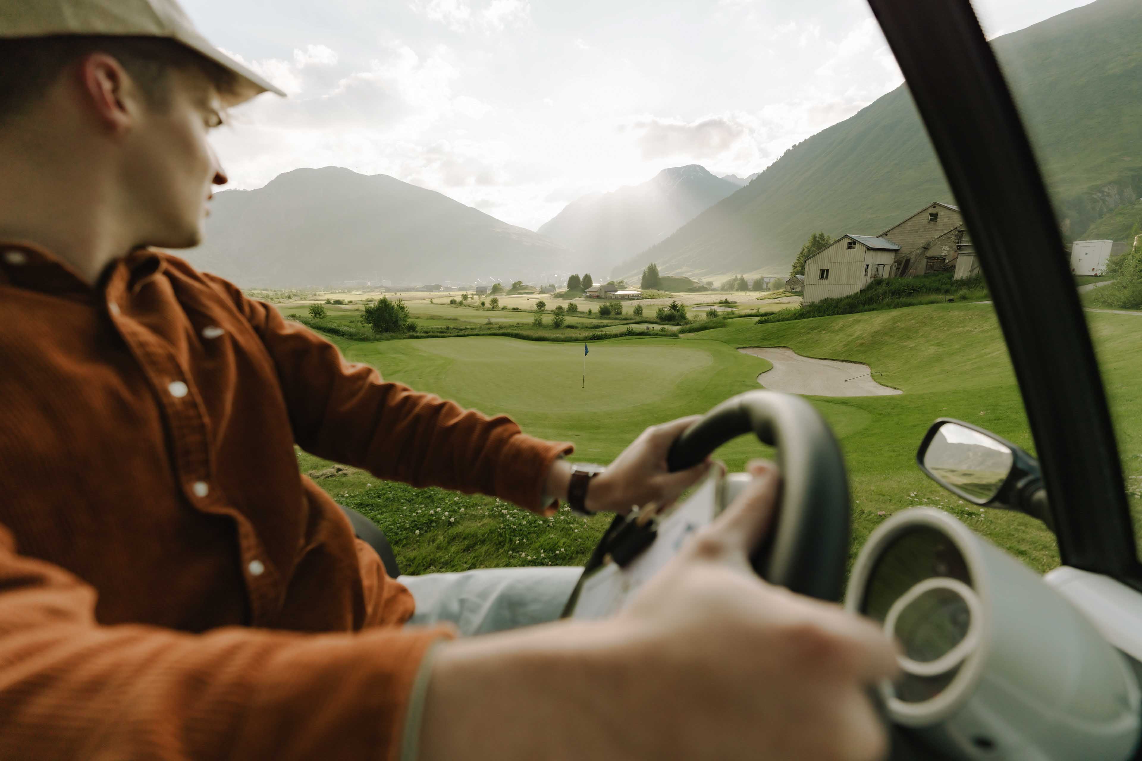 View out of a golf cart in the alps