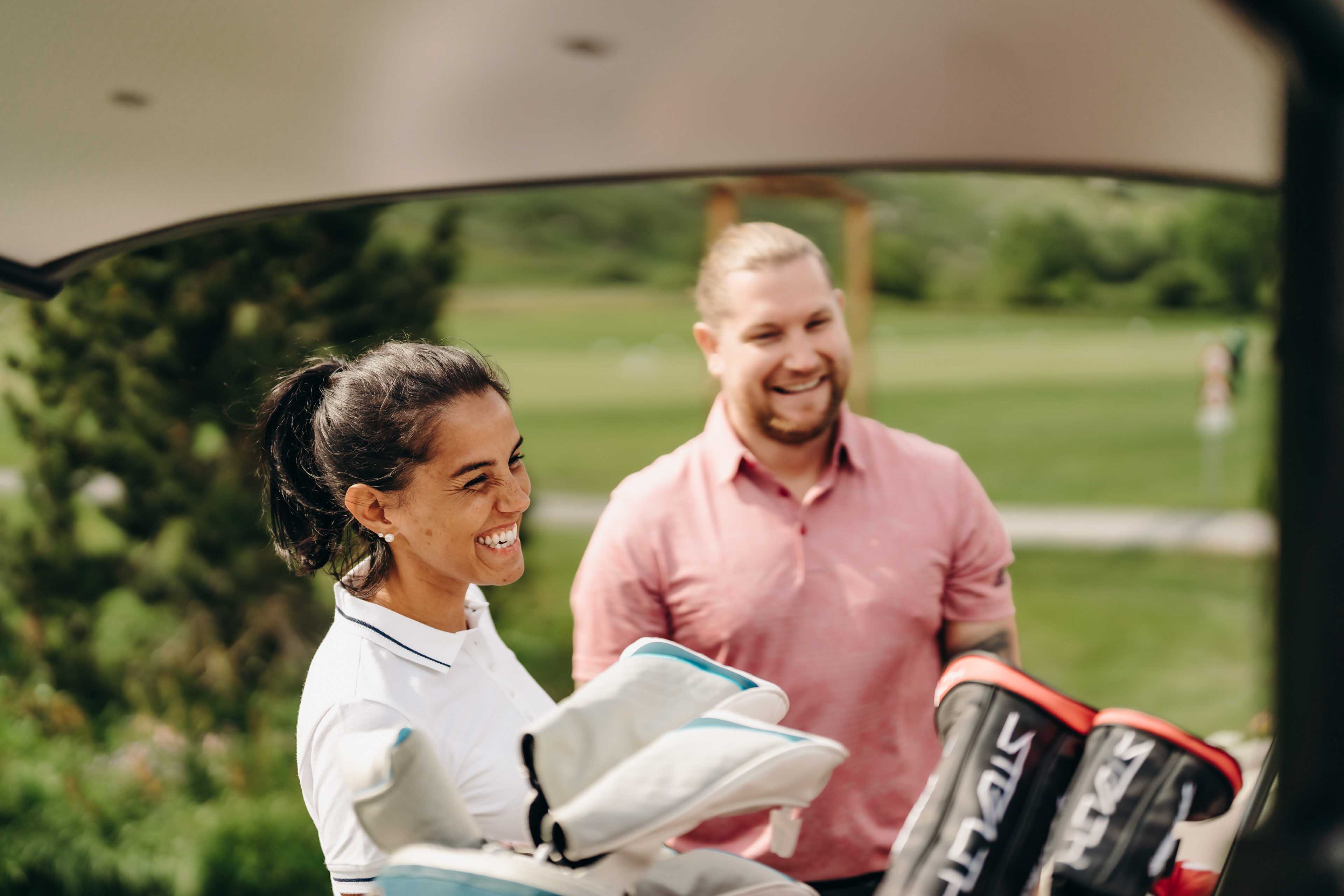 People laughing on the golf course