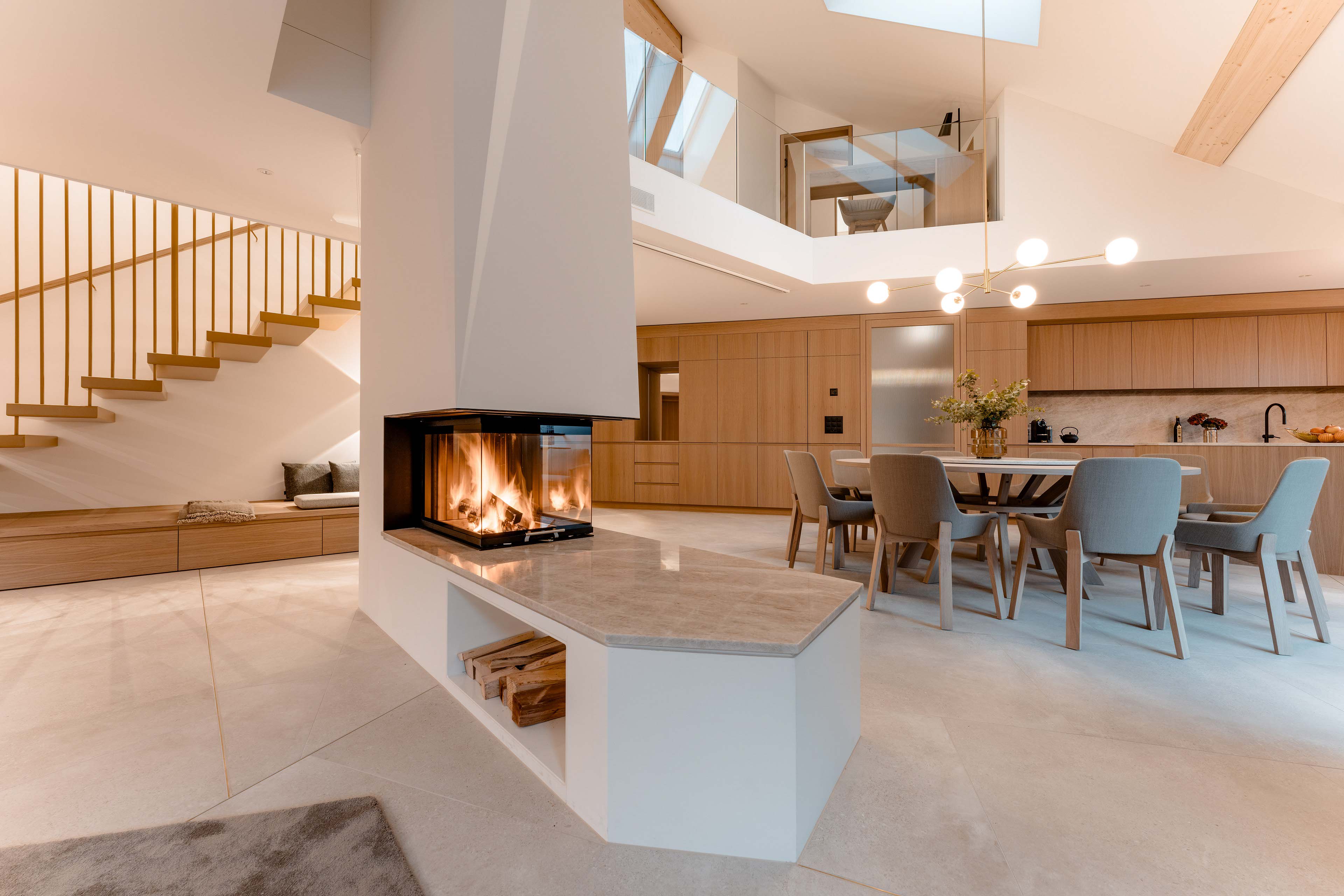 Blue hour light, fireplace in the Edelweiss Penthouse