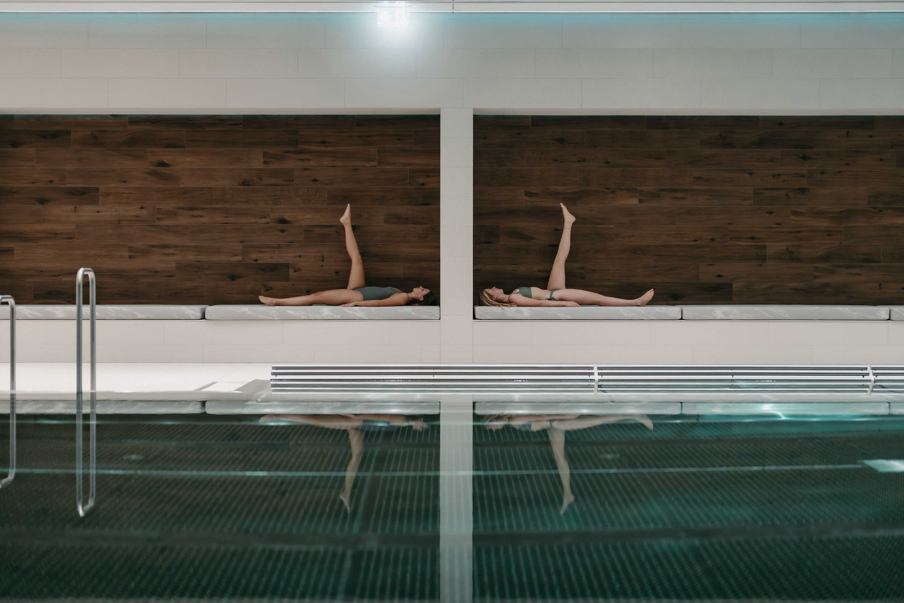 Abstract photograph of two women at the pool