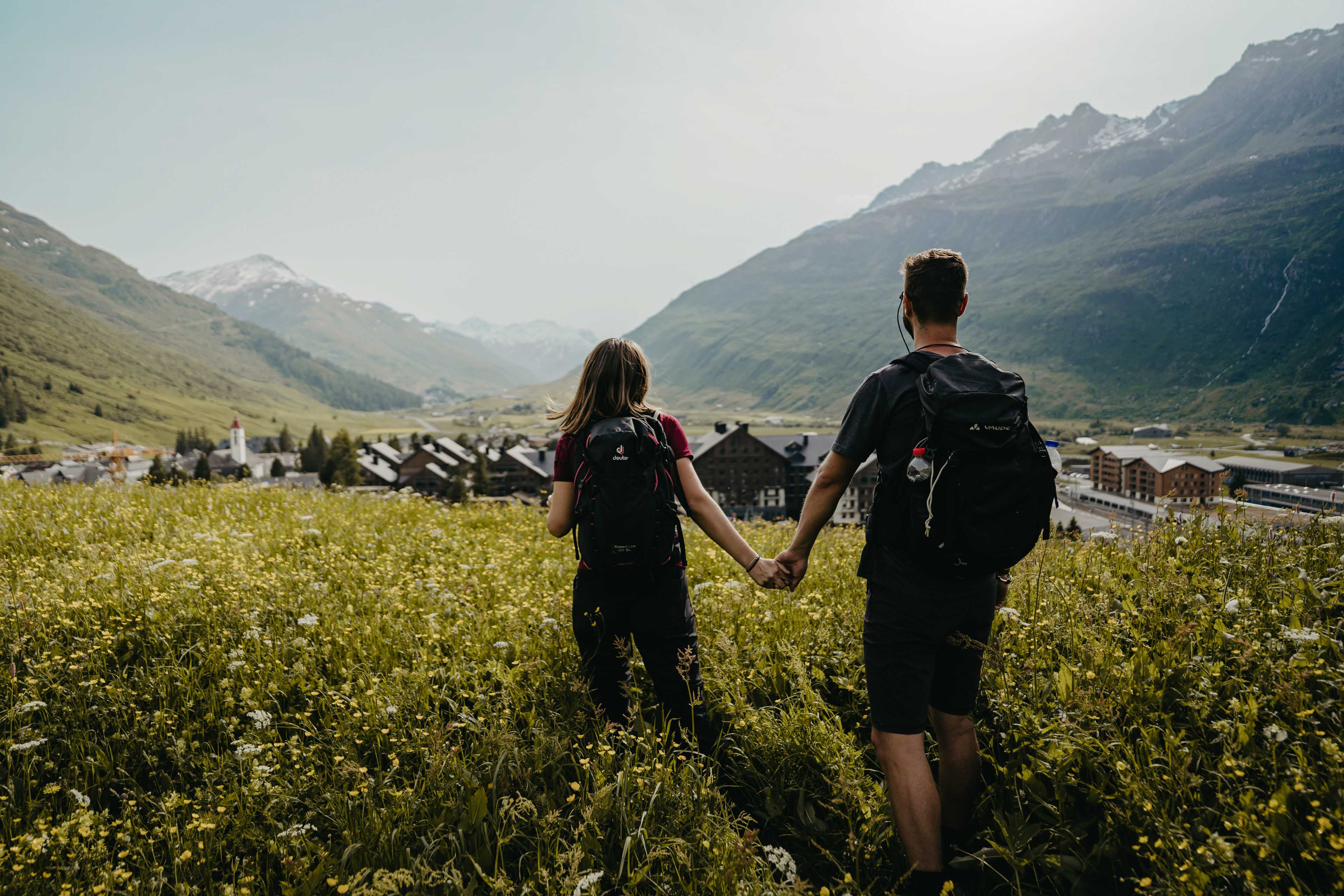 Couple above Andermatt on a flower field