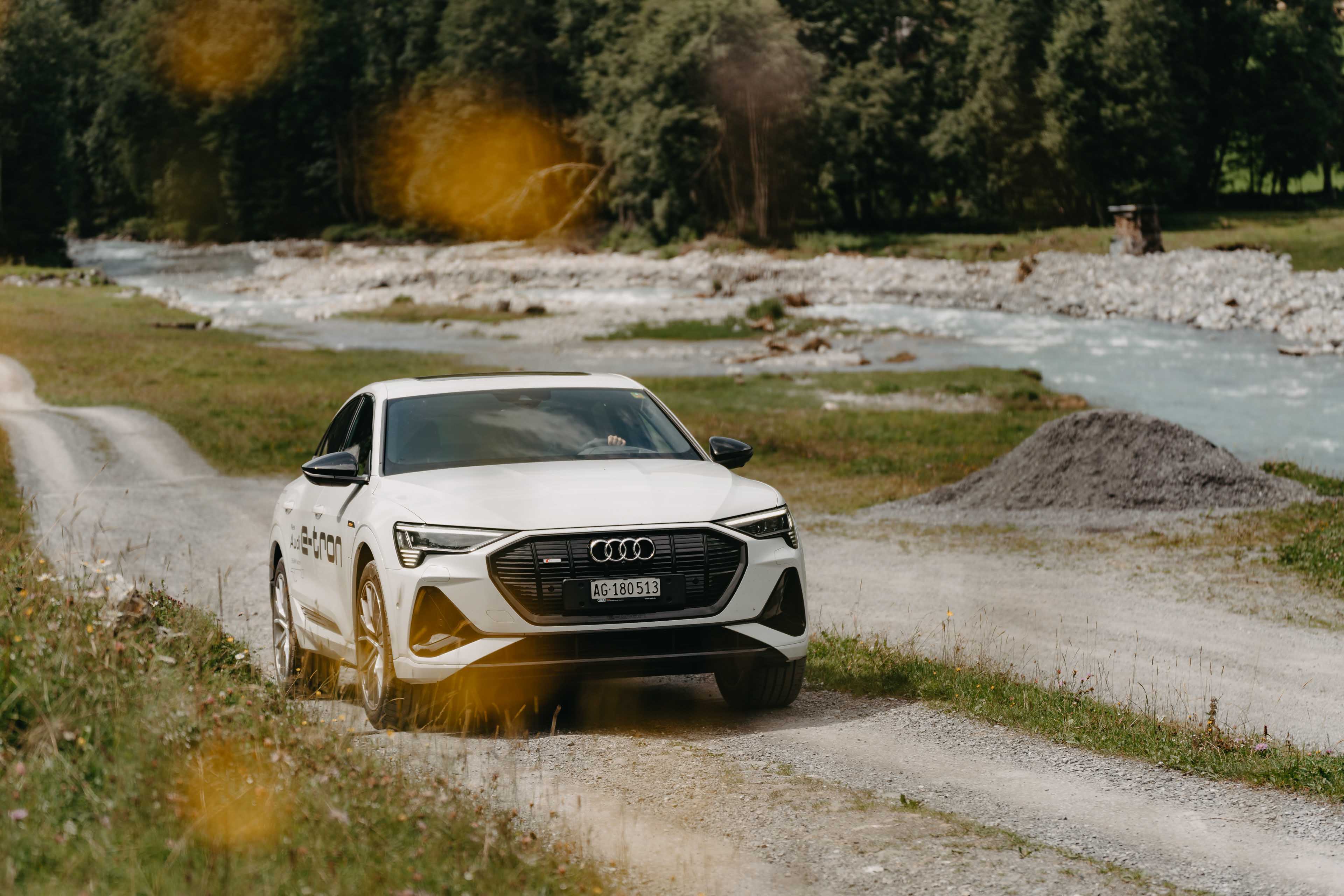 Audi driving through a wild valley