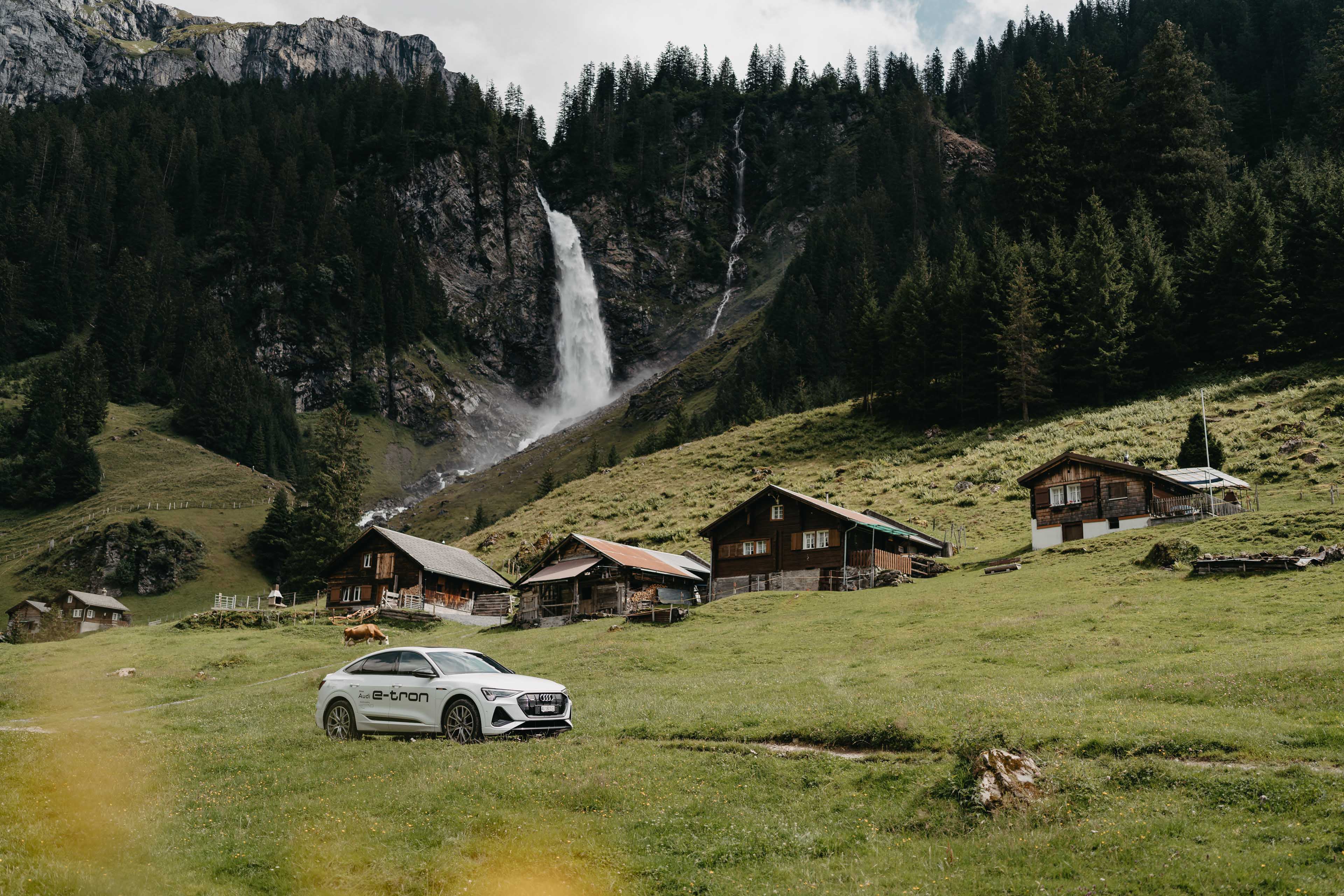 Audi in front of a waterfall