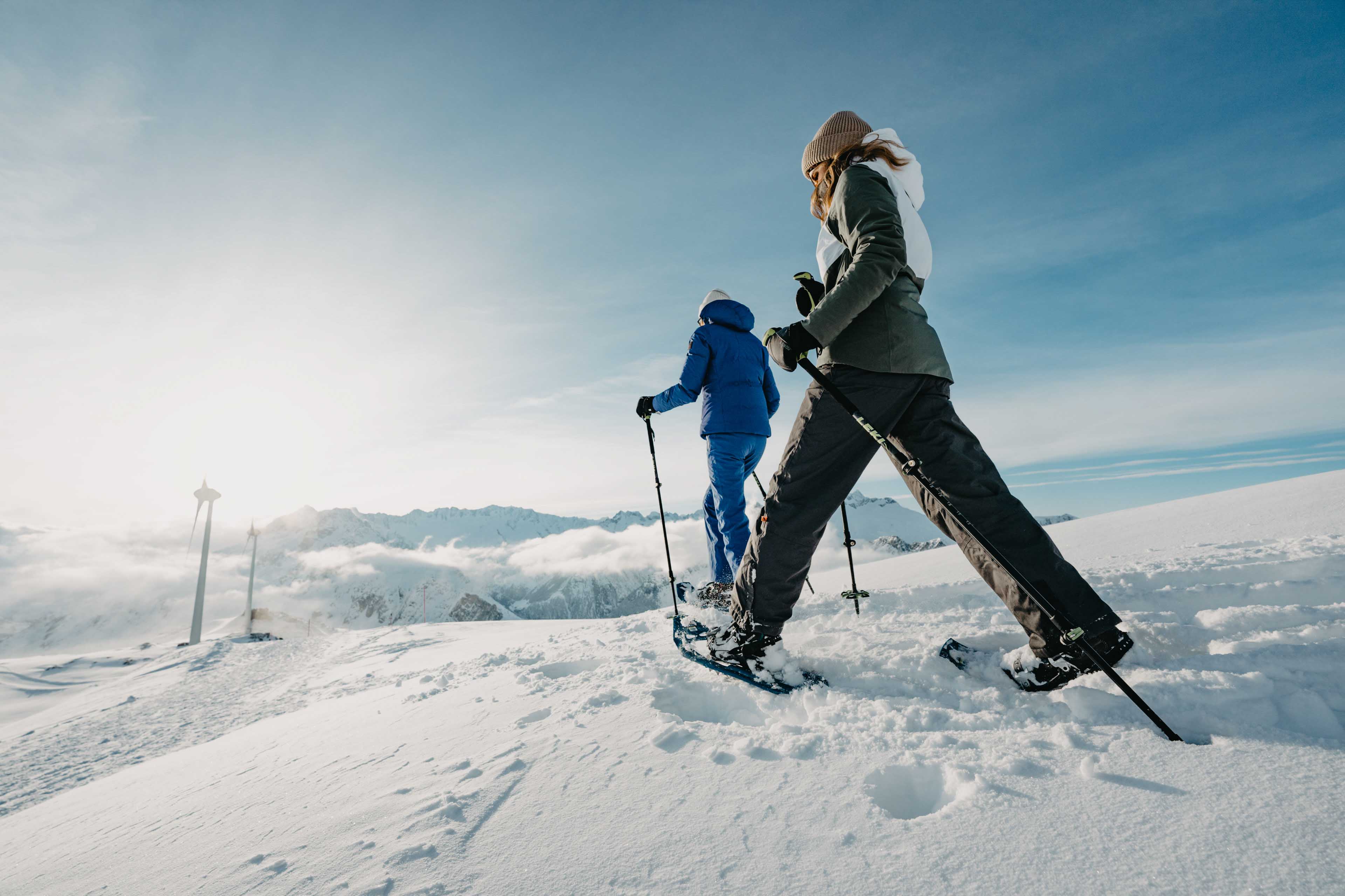 Two women snowshoeing