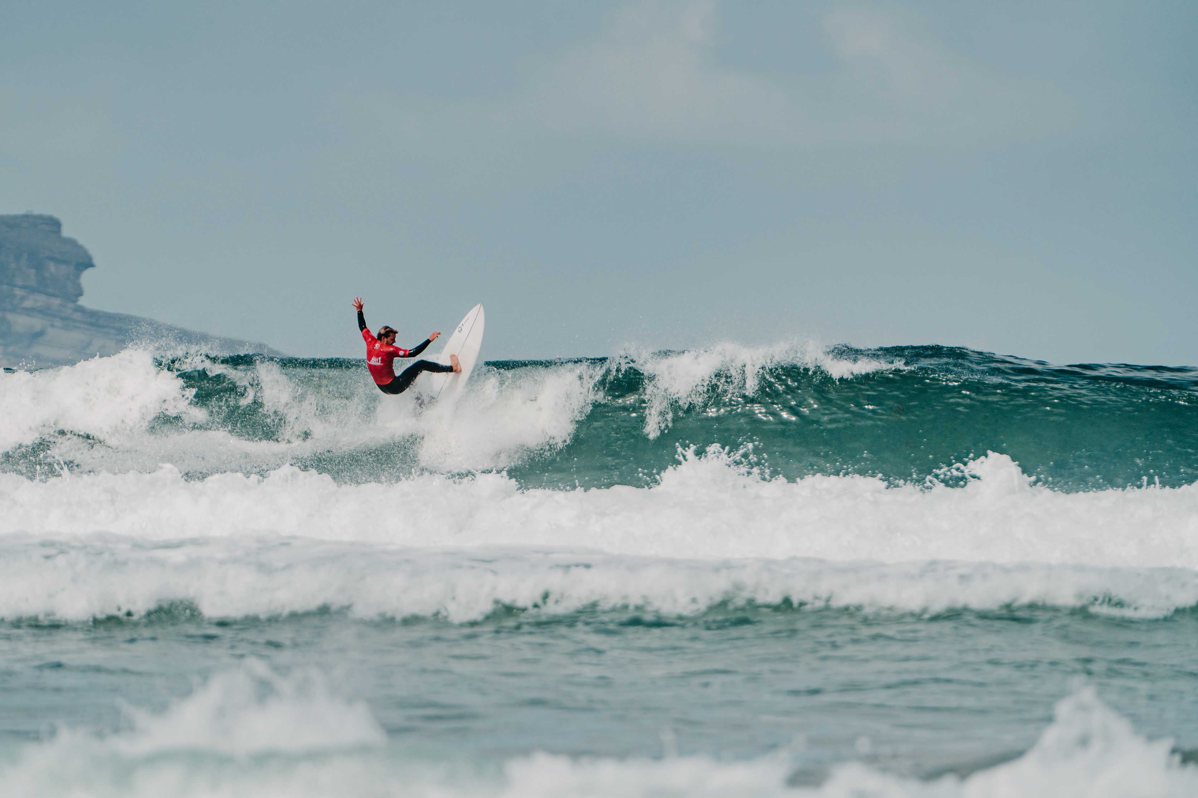 Surfer in action, doing fast maneuver