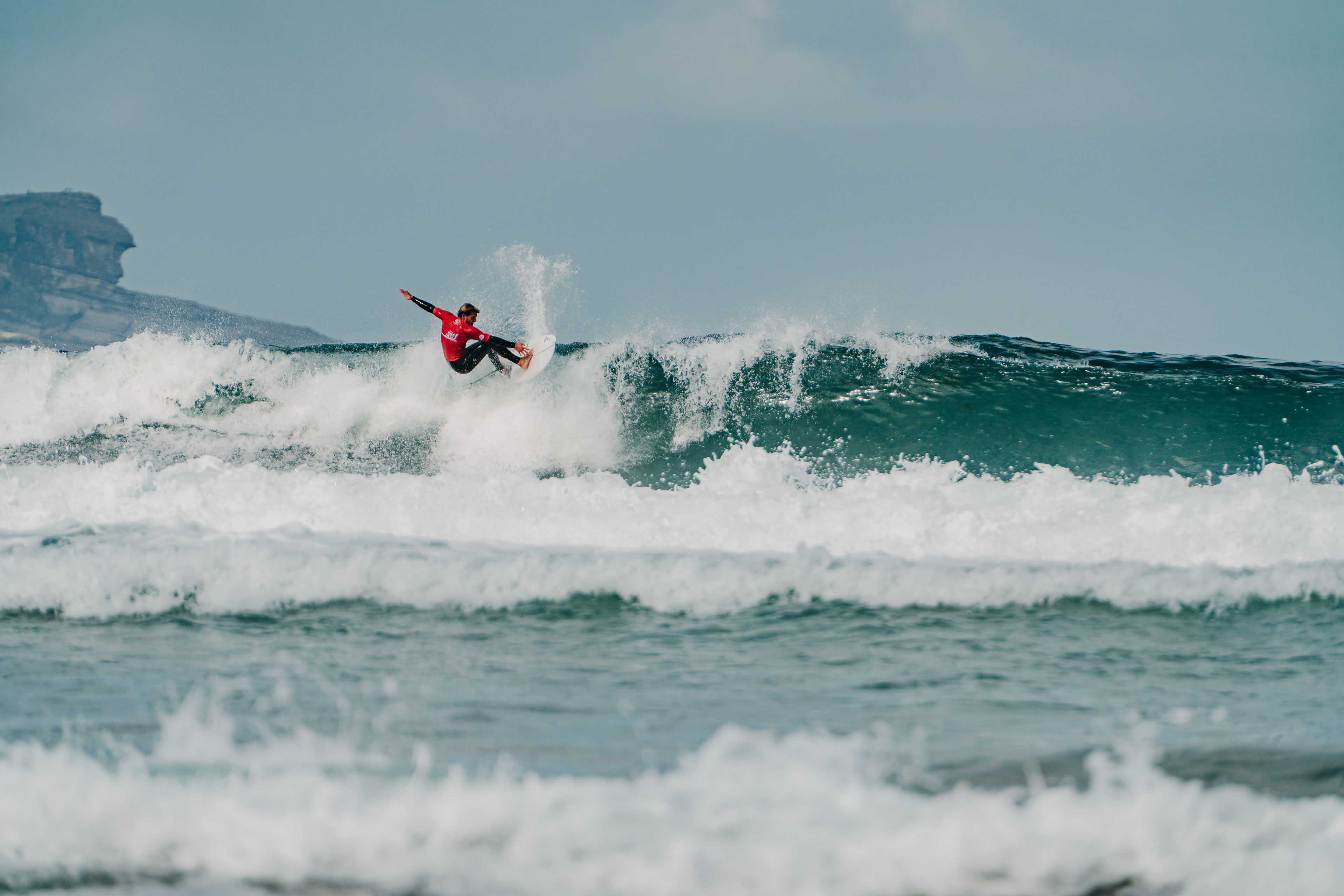 Surfer in action, continues previous maneuver