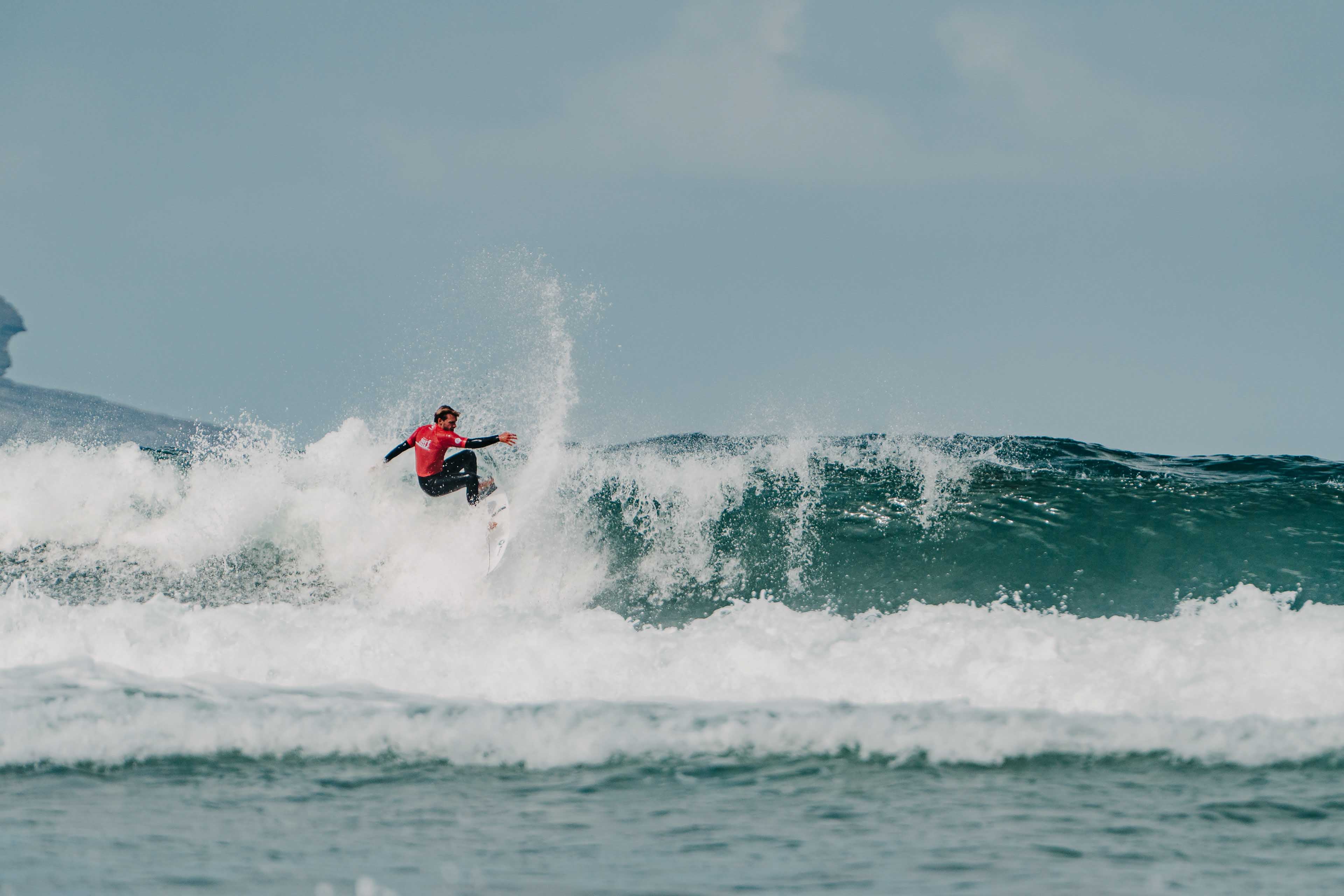 Surfer in action, ends previous maneuver