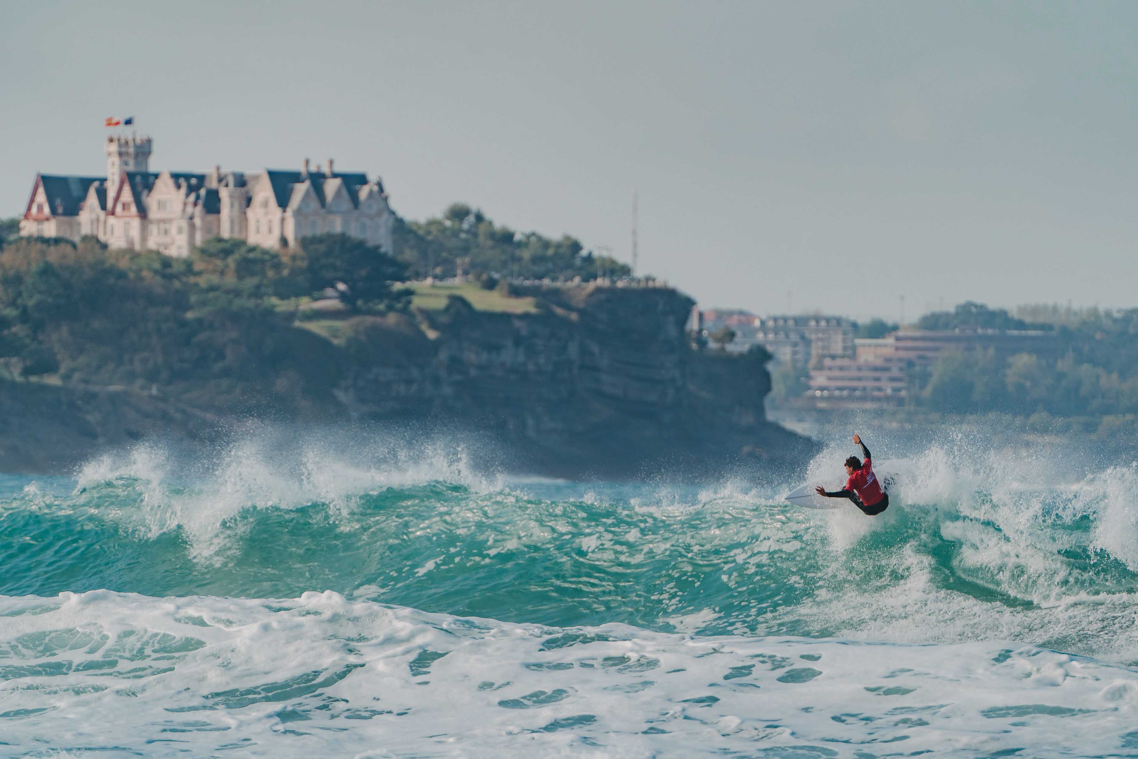 Surfer doing a maneuver on a wave in Spain